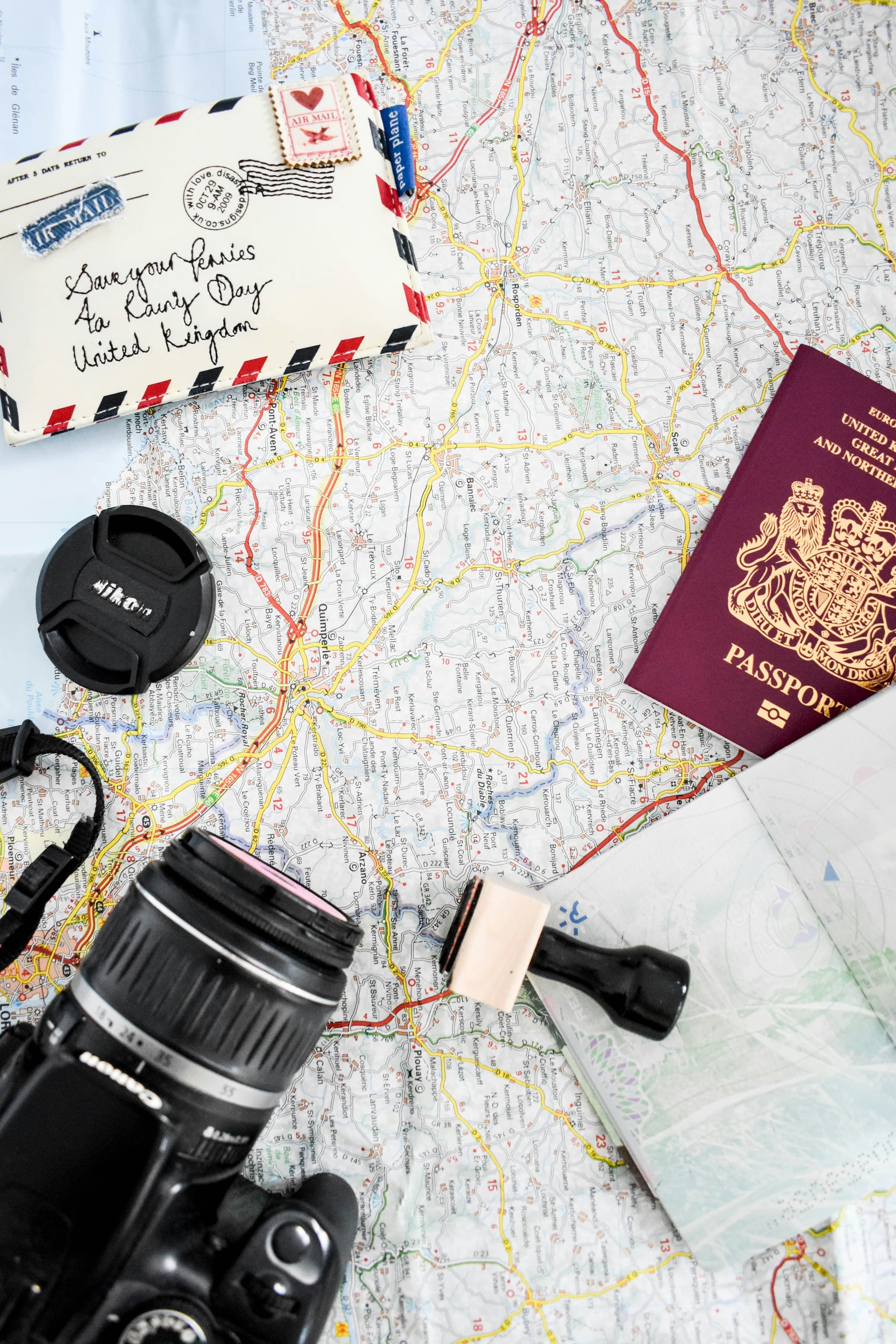 Passport and travel-planning materials arranged around a world map